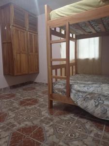 a bedroom with two bunk beds in a room at Cozy Two-bedroom Hot-Cold Water Apartment in Nueva California
