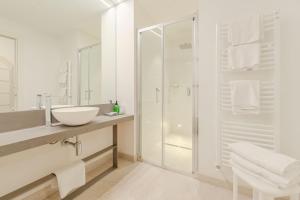 a white bathroom with a sink and a shower at Promenade Maison de Charme in Sanremo +56 photos
