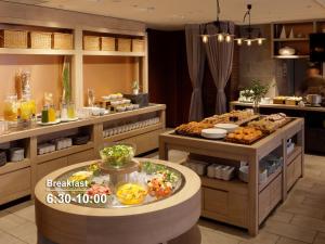a buffet line with many different types of food at Mitsui Garden Hotel Sapporo West in Sapporo