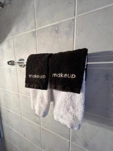 two towels on a towel rack in a bathroom at HYDRA Central House in Hydra +10 photos