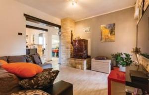 a living room with a couch and a fireplace at Gorgeous Apartment Garma in Kavran