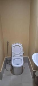 a bathroom with a toilet and a sink at Brenthill Condo Quartz unit in Baguio