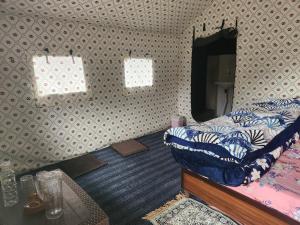 a bedroom with a bed and a mirror at New Kufari Apple Valley camping in Shimla