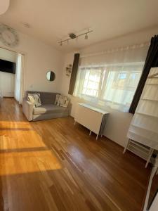 a living room with a couch and a table at Moderne Wohnung - ULM Stadtmitte in Ulm
