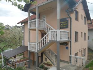 a building with stairs on the side of it at Guesthouse Behar in Sarajevo