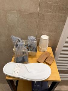 a table with a scissors and other items on it at Dimora Piazza Palazzo in LʼAquila +22 photos