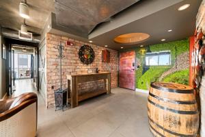 a wine tasting room with a wooden table and a brick wall at Hollywood Beach Speakeasy Condo with Pool in Hollywood