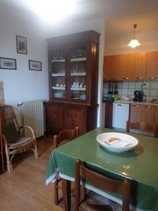 a kitchen with a table with a plate on it at Casa Bonaccorsi in Civitella Del Lago +15 photos