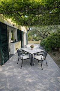 a table and chairs sitting on a patio at La casa di Fedra in Imperia