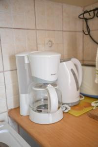 a white coffee maker sitting on top of a counter at Xenia's House in Kefalos