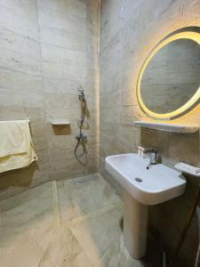 a bathroom with a sink and a shower at SiwaTu Lodge in Siwa +66 photos