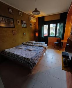 a bedroom with two beds and a large window at Lakea Apartments in Virpazar