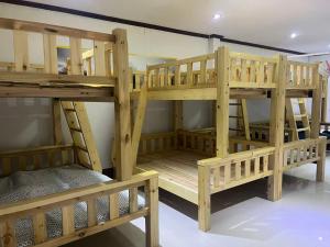 a couple of bunk beds in a room at FUBON World in Vientiane