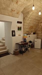 a living room with a table and a staircase at TerraCielo in Bisceglie