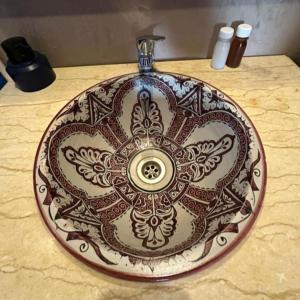 a sink on a counter with a design on it at Sunny Luxury Camp in Merzouga +54 photos