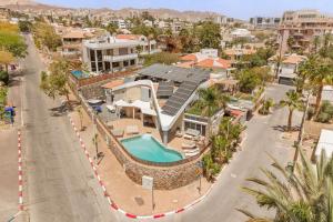 an aerial view of a house with a swimming pool at Villa Yuka- Luxurious Villa in Eilat