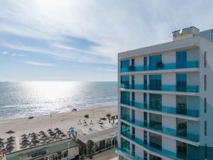 a view of a hotel and the beach at Nava Star Hotel in Durrës