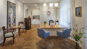 a kitchen and dining room with a table and chairs at SeNo6 Apartments in Prague
