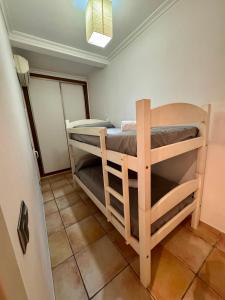 a bedroom with two bunk beds in a room at Rosa Somhome in Peniscola