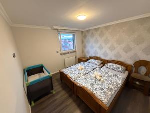 a bedroom with a bed with two teddy bears on it at Apartment in Otterberg in Otterberg
