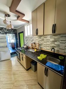 a kitchen with a sink and a counter top at Nador cornich calme in Nador