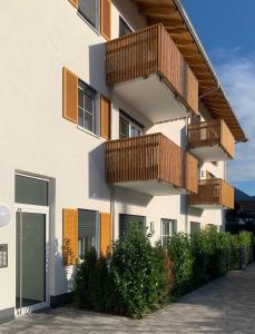 a building with balconies on the side of it at Maisonette Wohnung am Tegernsee in Bad Wiessee +21 photos