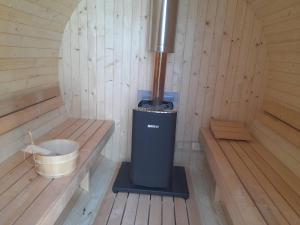 a inside of a sauna with a trash can at Chata Ružín nad Vodou in Margecany