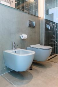 a bathroom with a white sink and a toilet at Nava Star Hotel in Durrës +87 photos