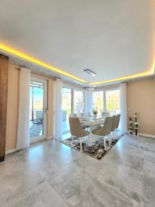 a dining room with a table and chairs at Villa Panorama View Brezovica in Brezovica