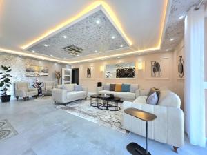 a large living room with couches and a table at Villa Panorama View Brezovica in Brezovica