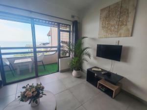 a living room with a view of the ocean at Aloe Shore- Whale Watch from Balcony- Stunning in Umdloti