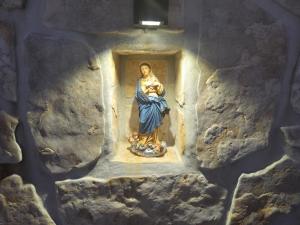 a statue of a woman in a niche in a wall at Adria Stone House in Grižane +99 photos