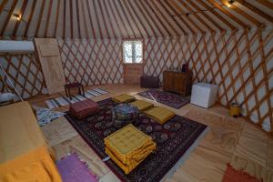an aerial view of a yurt with a room with a rug at Amapolas agri glamping in Camerano +7 photos