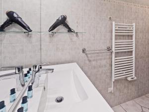 a bathroom with a sink and a mirror at Villa La Dorada, Normandy in Ver-sur-Mer +23 photos