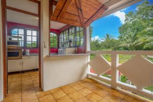 an open kitchen with a large window in a house at écrin de Monpierre in Brion