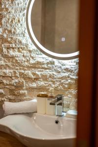 a bathroom with a sink and a mirror at Vila Kollari in Ulcinj +62 photos