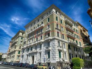 a large building on the side of a street at Home Grifondoro Affittacamere in Genoa