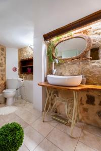 a bathroom with a sink and a mirror at Attiki Hotel in Rhodes Town +117 photos