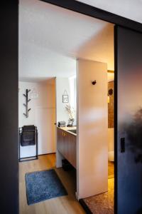 a kitchen with a sink and a counter at La petite chambre in Bennekom