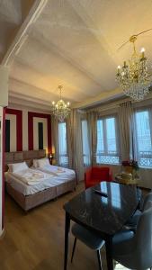 a bedroom with a bed and a table and chairs at Ehli Keyf Hotel in Istanbul