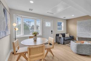 a living room with a table and chairs and a couch at Prof Cleaned | Linen+Towel | Pet Friendly | Coffee in Seaside Heights