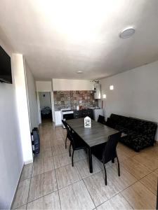 a living room with a table and a couch at La unión in Ciudad Lujan de Cuyo
