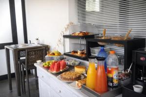 a buffet with different types of food and drinks at Monte Monaco B&B in San Vito lo Capo +39 photos