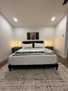 a bedroom with a large bed with two night stands at Doc Hollywood in Stanton
