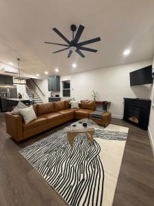 a living room with a couch and a fireplace at Doc Hollywood in Stanton