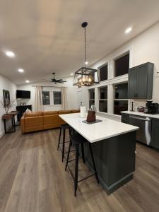 a kitchen and living room with a table and a couch at Doc Hollywood in Stanton +21 photos