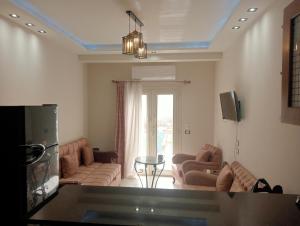 a living room with two couches and a table at Hurghada, El-Marina in Hurghada