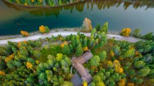 an aerial view of a house in the trees next to a lake at Secluded River View Hideaway in Hungry Horse