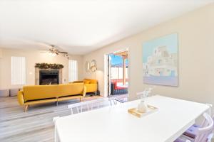a living room with a yellow couch and a table at The AZ Escape in Tucson