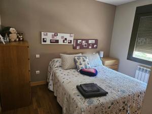 a bedroom with a bed with a suitcase on it at Casa Tejada in San Rafael